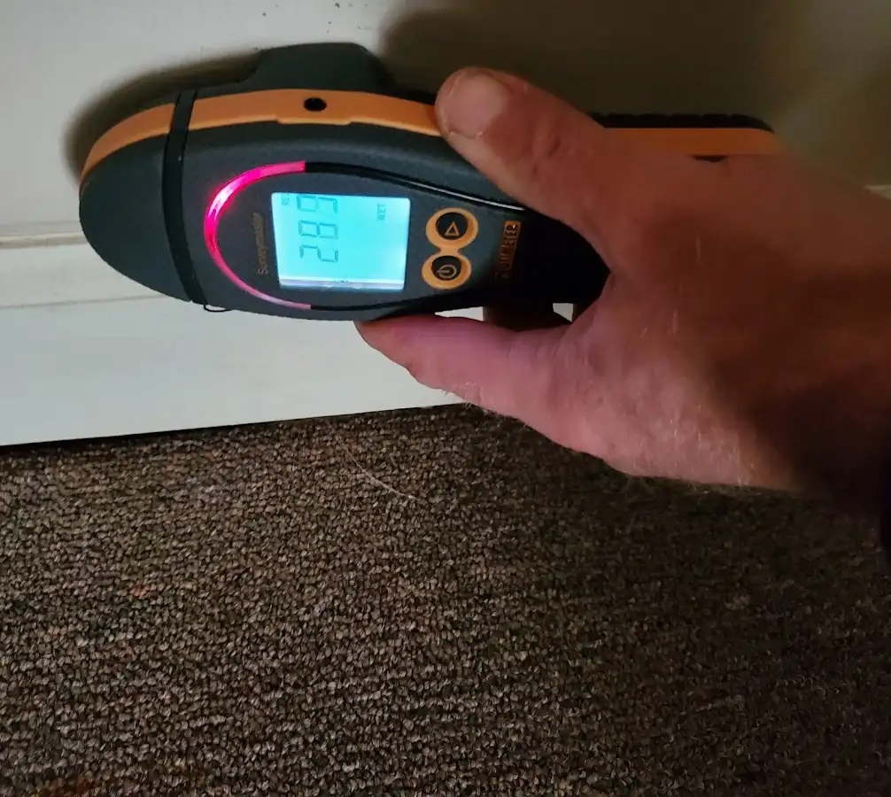 Moisture detection at baseboard during Storm Damage Restoration in Conway